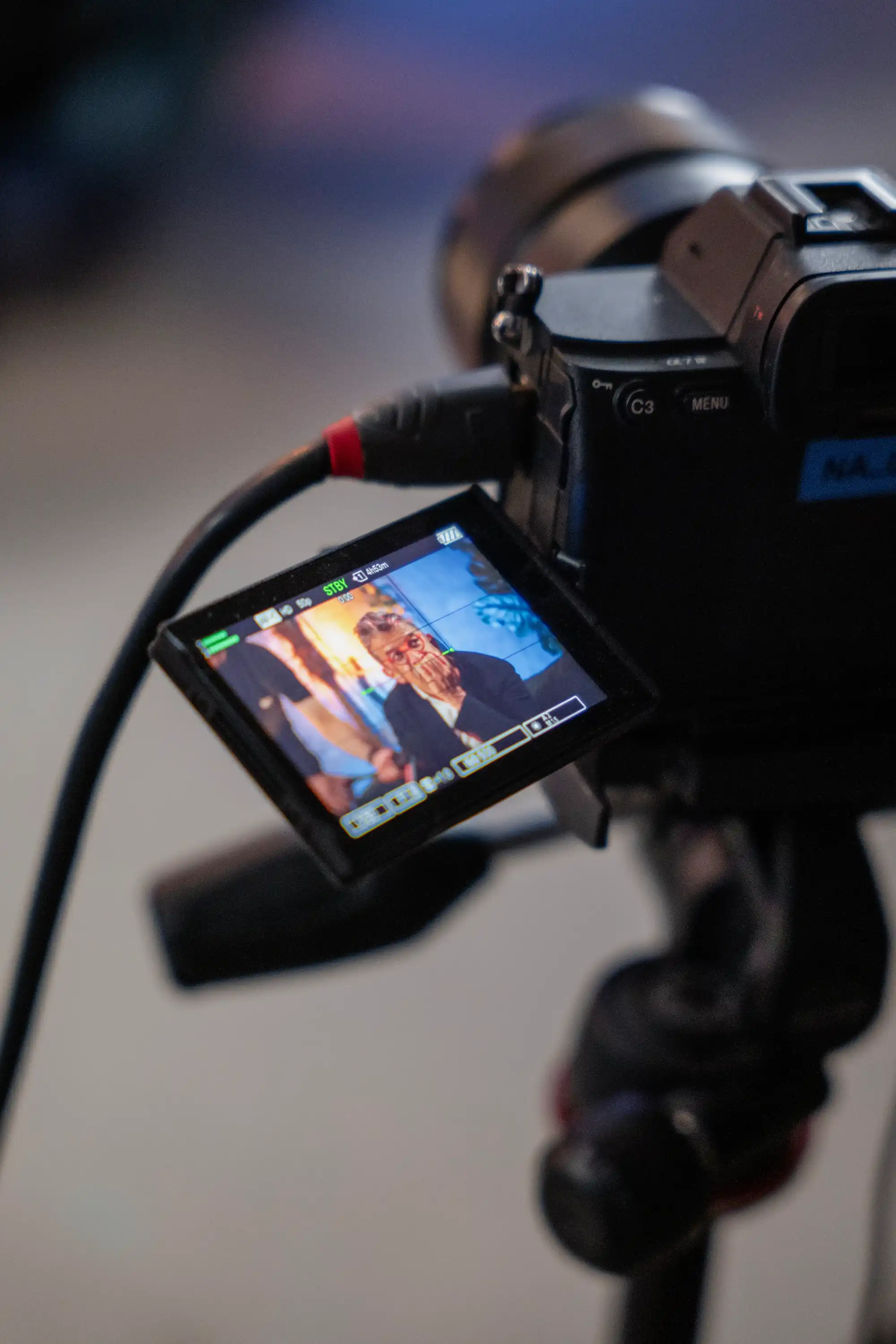 Écran retour caméra — invité dans le viseur